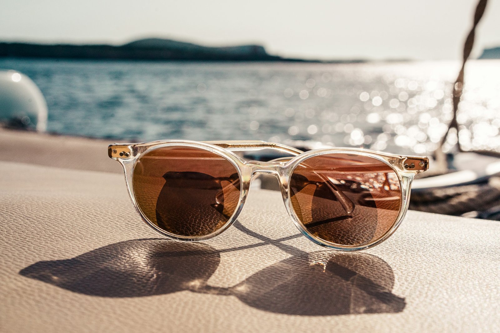 White frame sunglasses with brown lenses