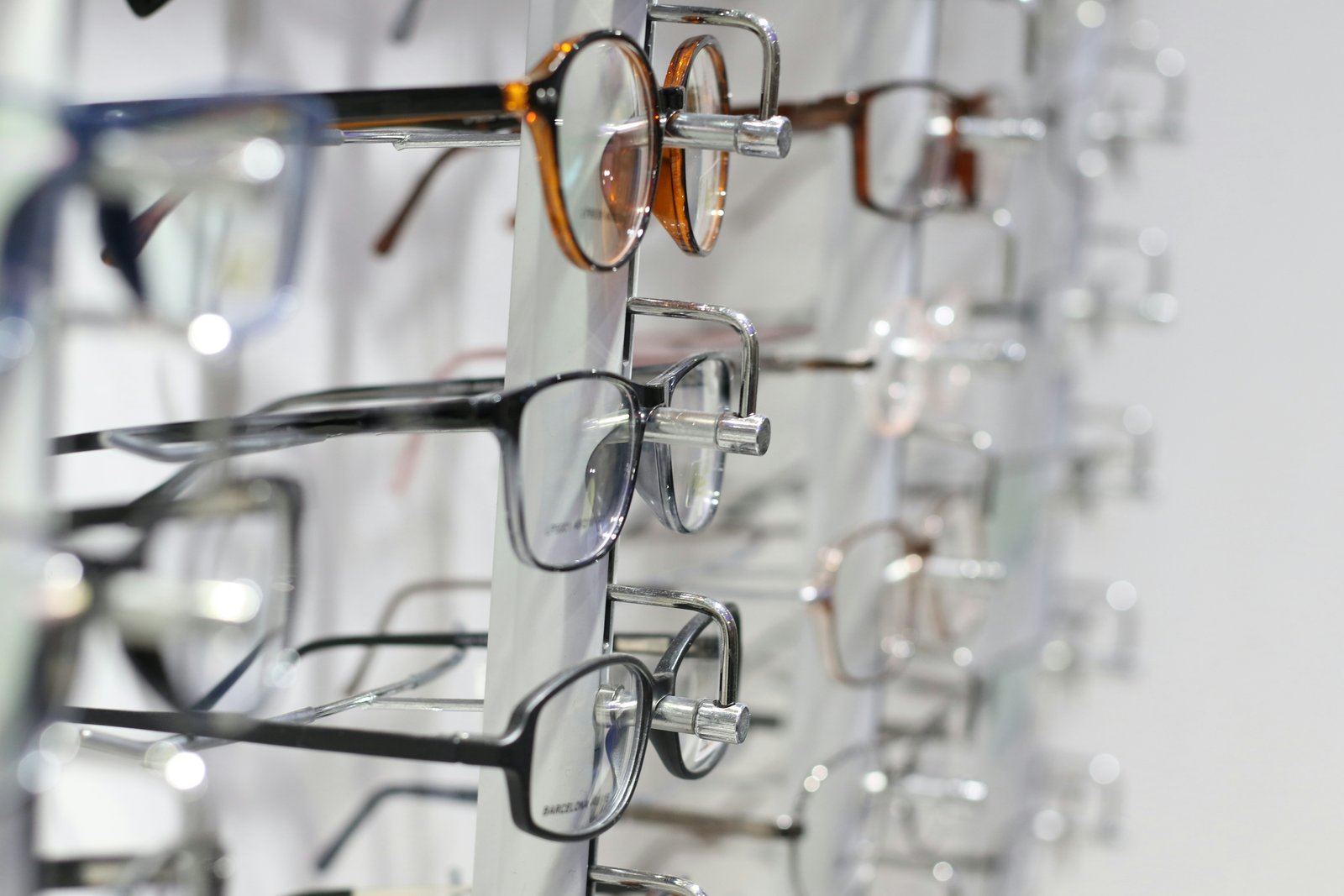 Silver eyeglass frames on clear glass