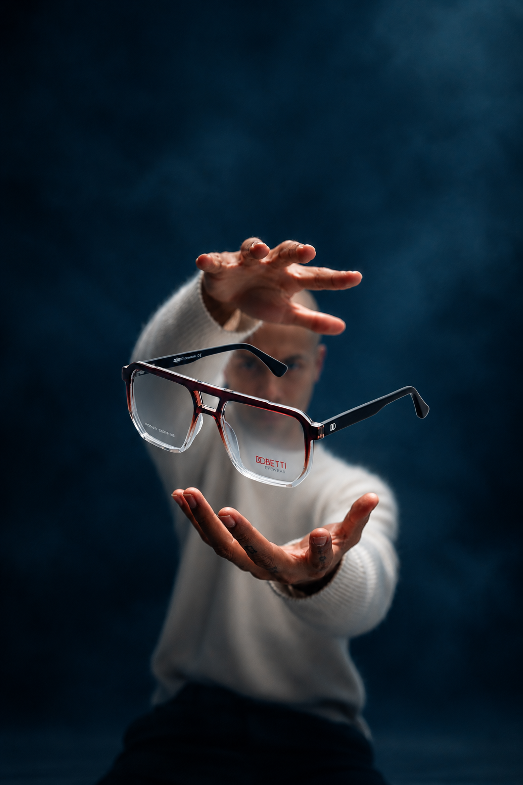 Men's eyeglasses on a sunlit surface